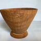 Asymmetrical wooden sculpted catchall.