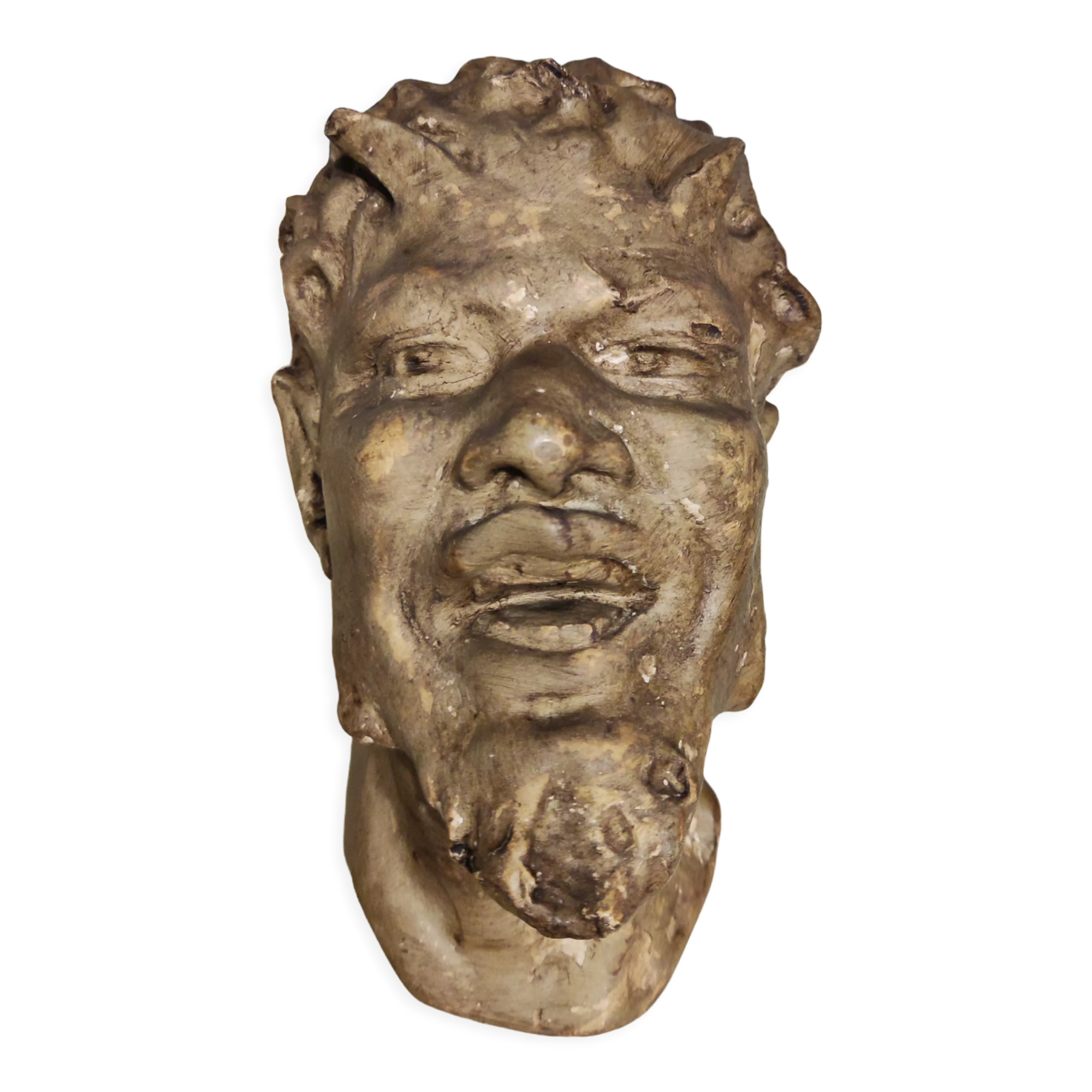 Head of satire in plaster