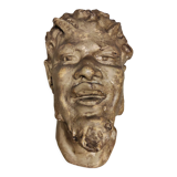 Head of satire in plaster