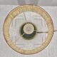 Brass table lamp with green patina and empire-style fabric shade.