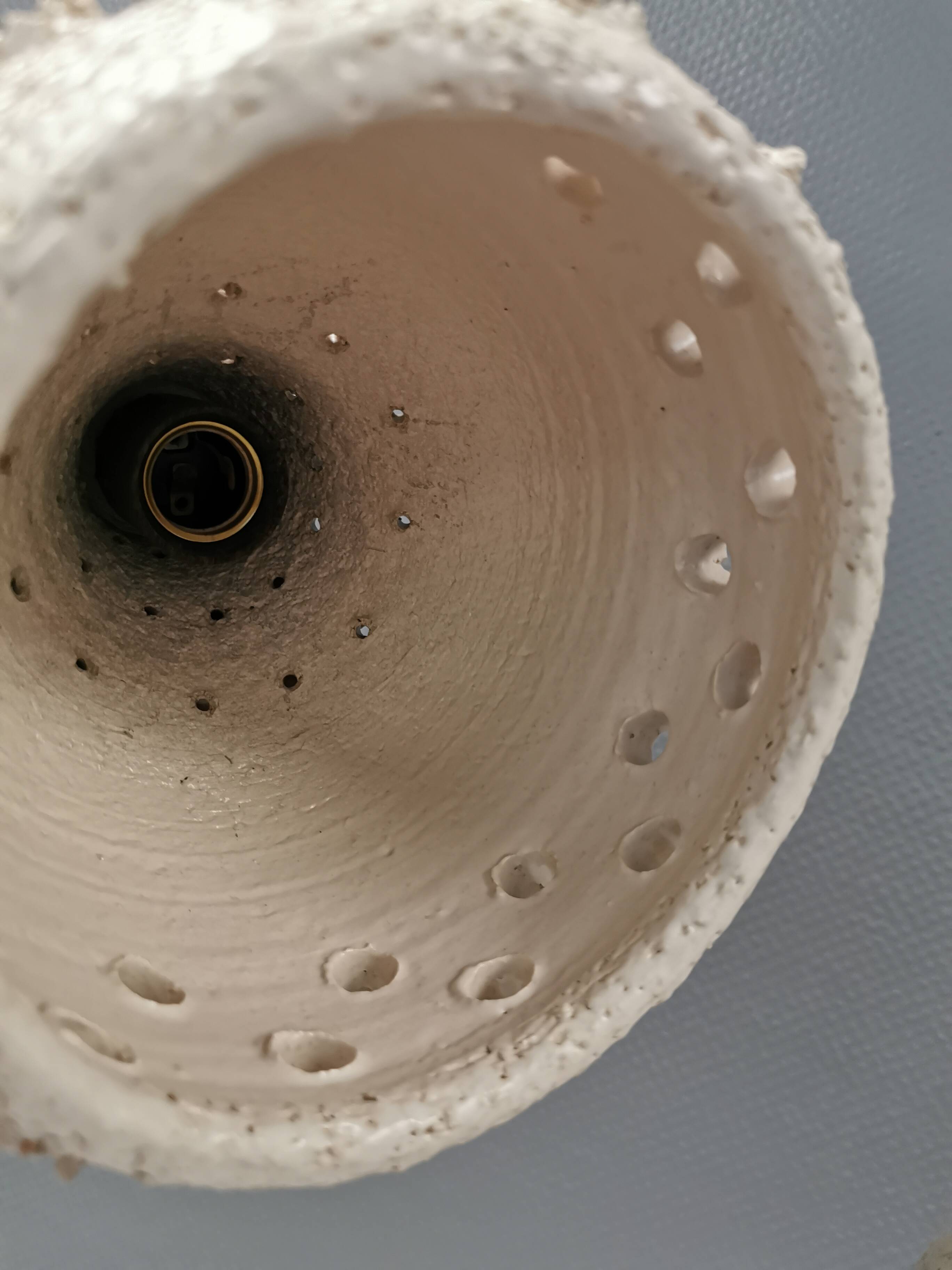 Two ceramic hanging lamps, in creamy white color, looking almost like coral