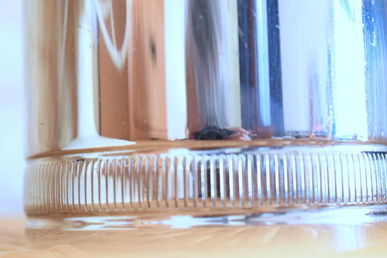 Silver metal siphon.