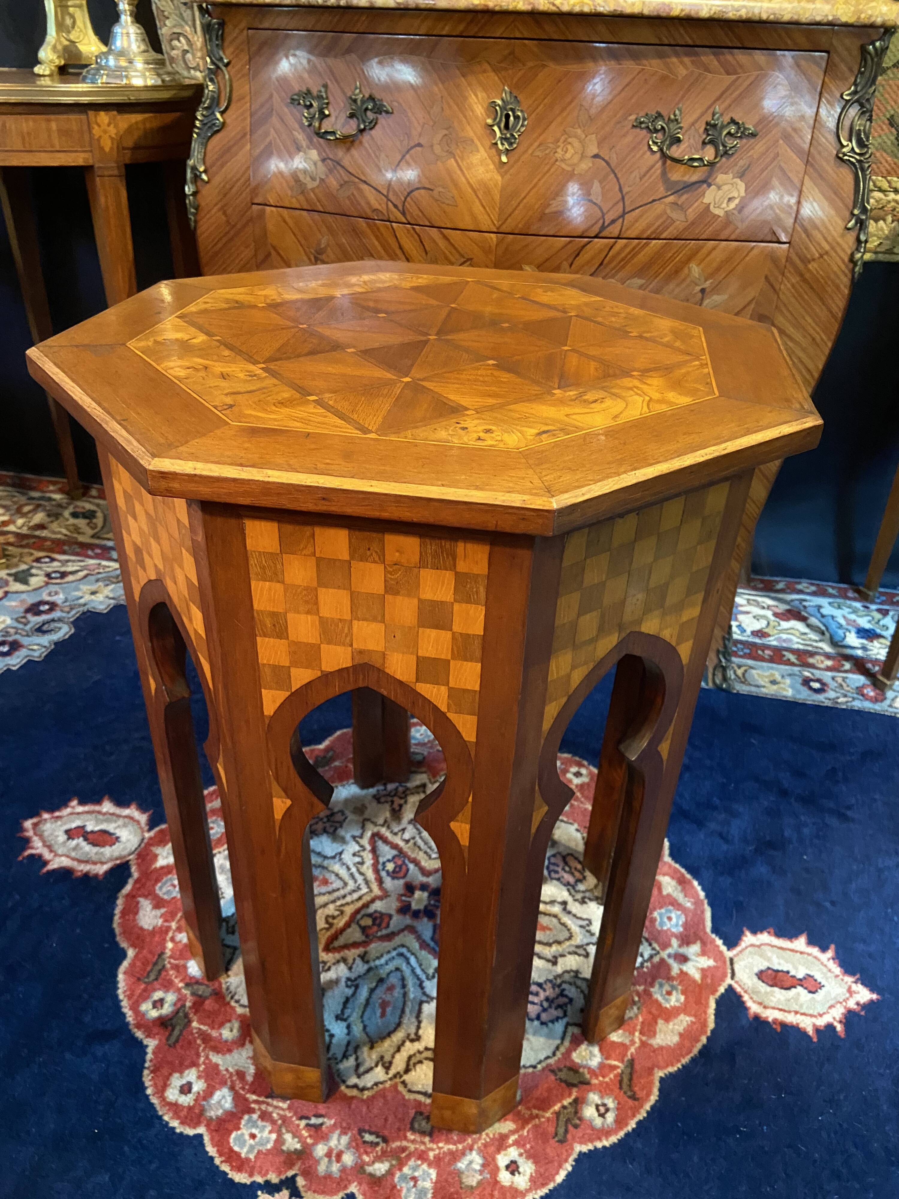 Thuyawood tea table with marquetry decoration.