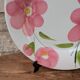 Round serving dish with hand-painted pink flowers in San Marciano ceramic.
