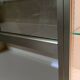 Ivory-colored and matte gold anodized aluminum display bookcase