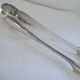 Christofle Silver-plated metal sugar tongs with crossed ribbon bow design