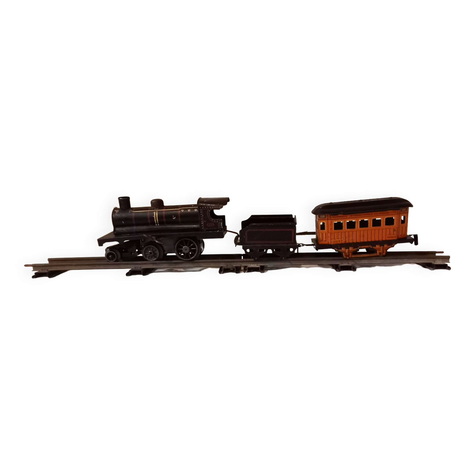 Small JEP mechanical train, including locomotive, tender, sleeping car, rail, 1930s