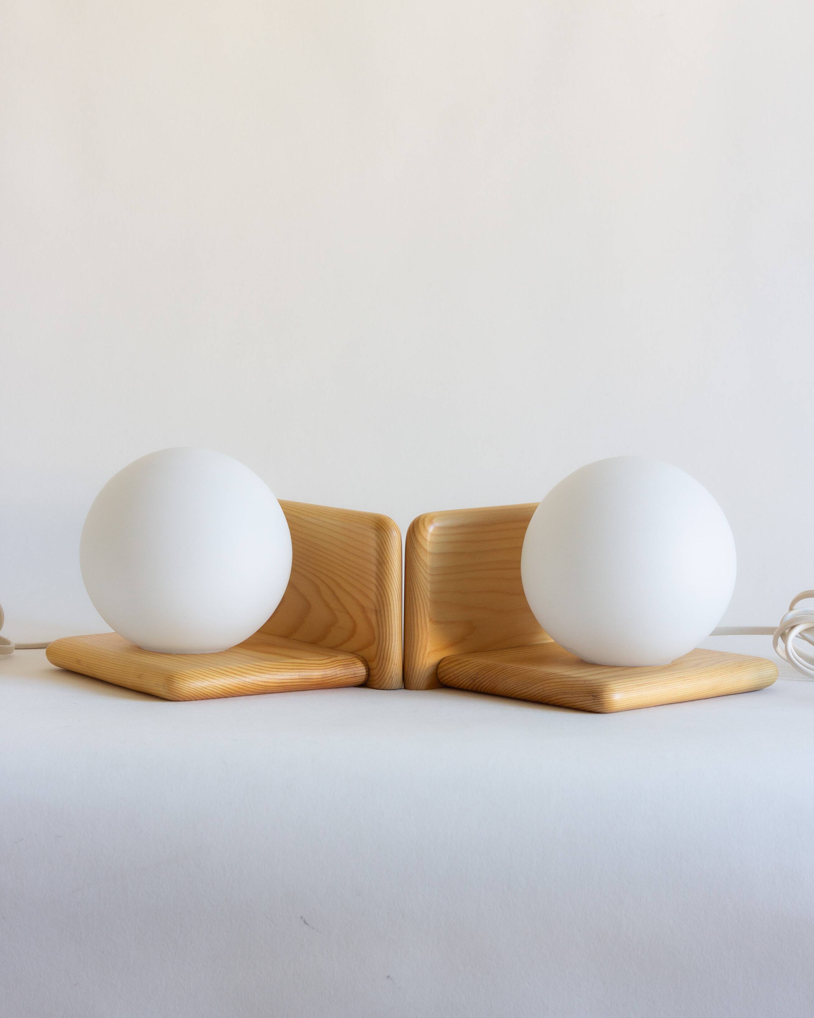 Duo of pine and opaline glass wall lights, 1980s