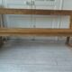 Church bench, bed end in pitch pine with light oak wax finish.