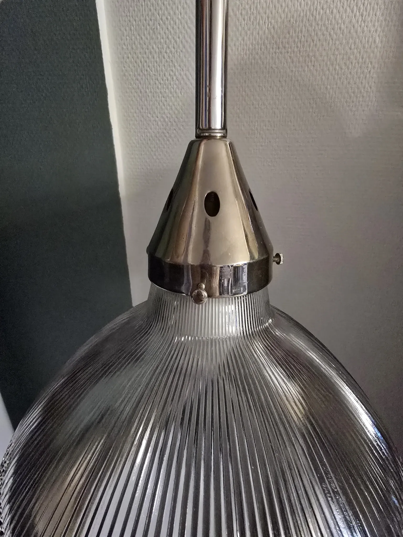 Vintage globe-style holophane on a chrome stem.