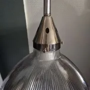 Vintage globe-style holophane on a chrome stem.