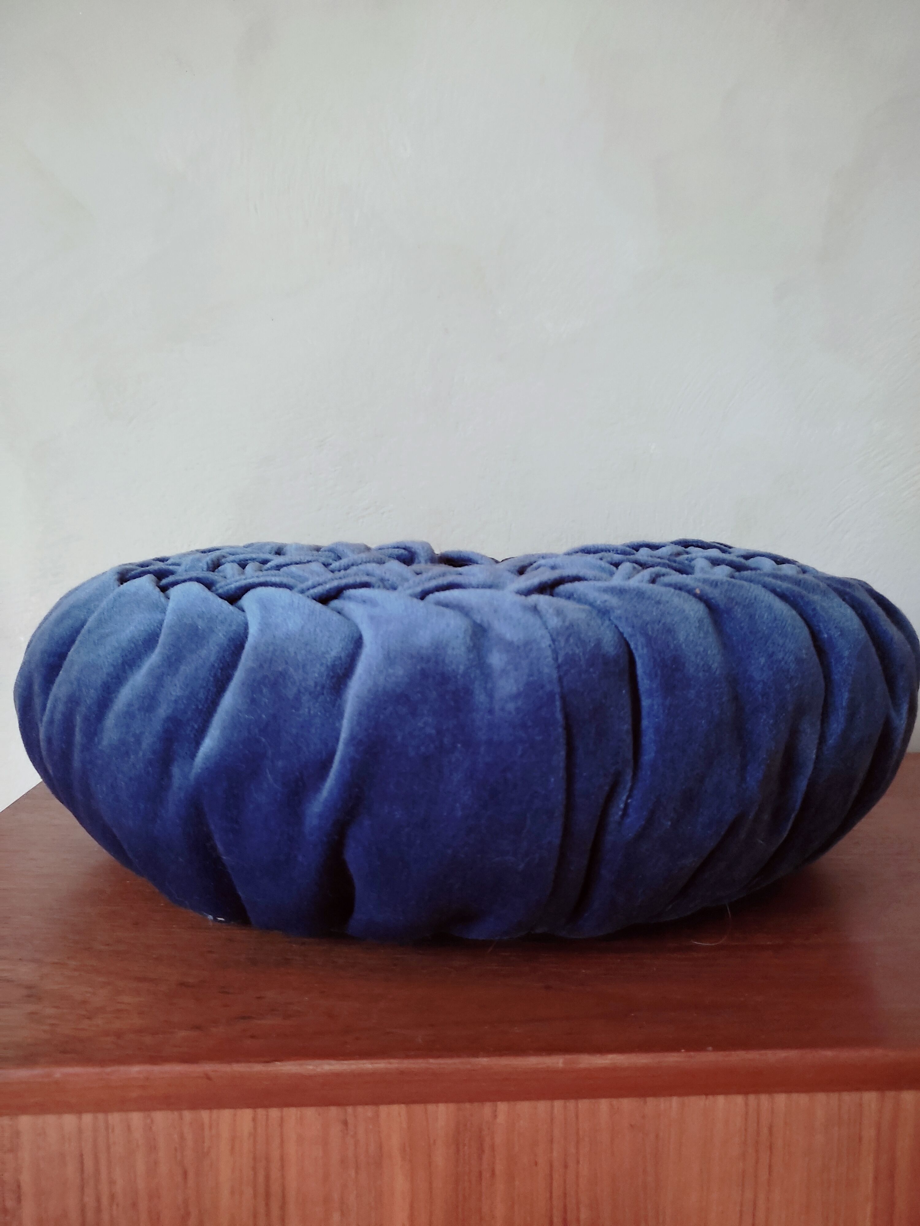 Round pleated velvet cushion