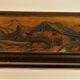 Vintage carved wooden box of a mountain landscape in relief