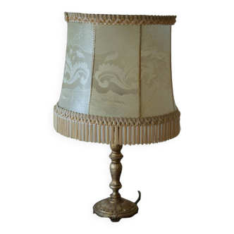 Table lamp with parchment lampshade with braid and fringes