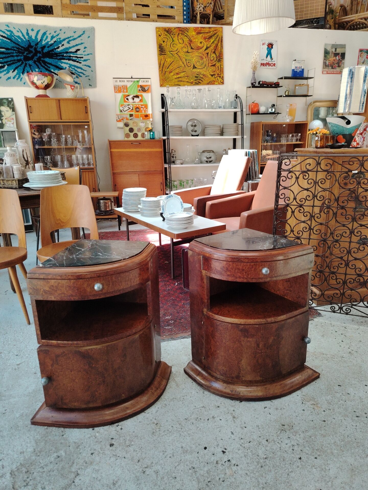 Pair of Art Deco half-moon bedside tables in walnut veneer and black marble.