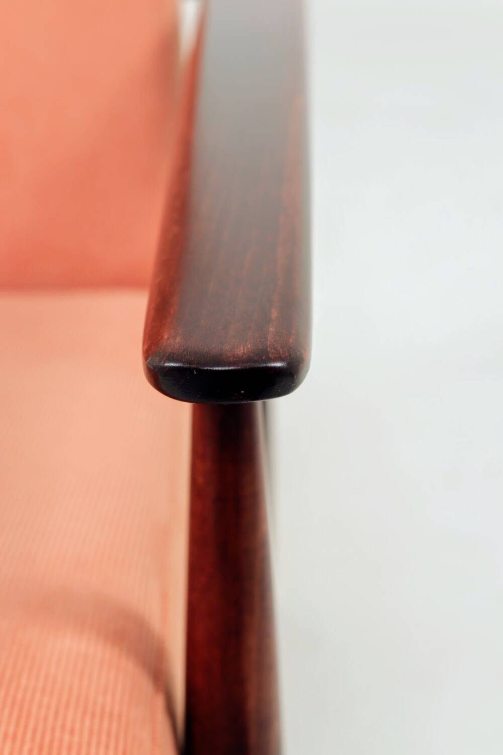 Mid-century modern armchair in coral red designed by H. Lis.