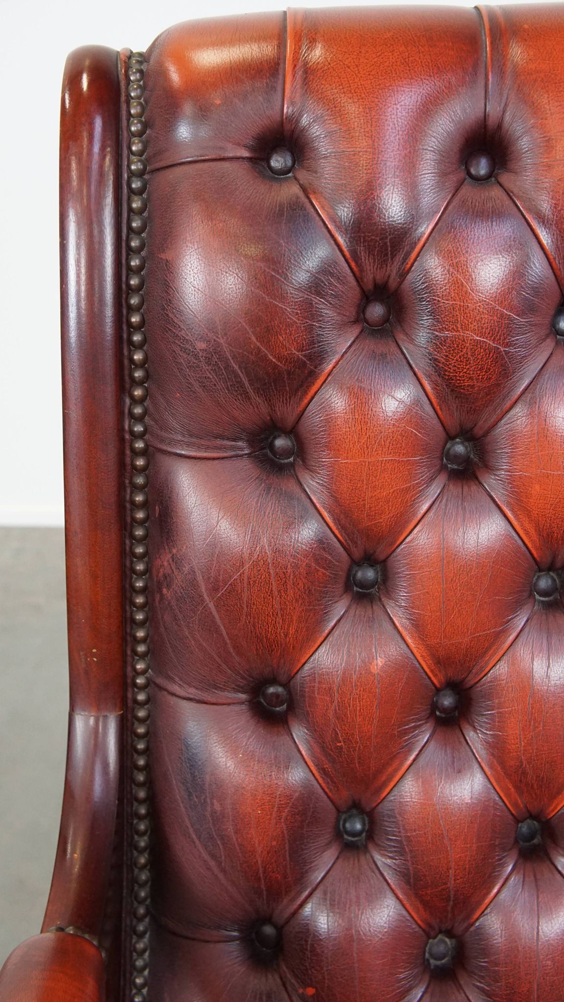 Red cowhide leather English Chesterfield armchair combined with wood