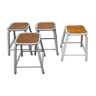 Set of four stackable tubular metal and wood industrial stools