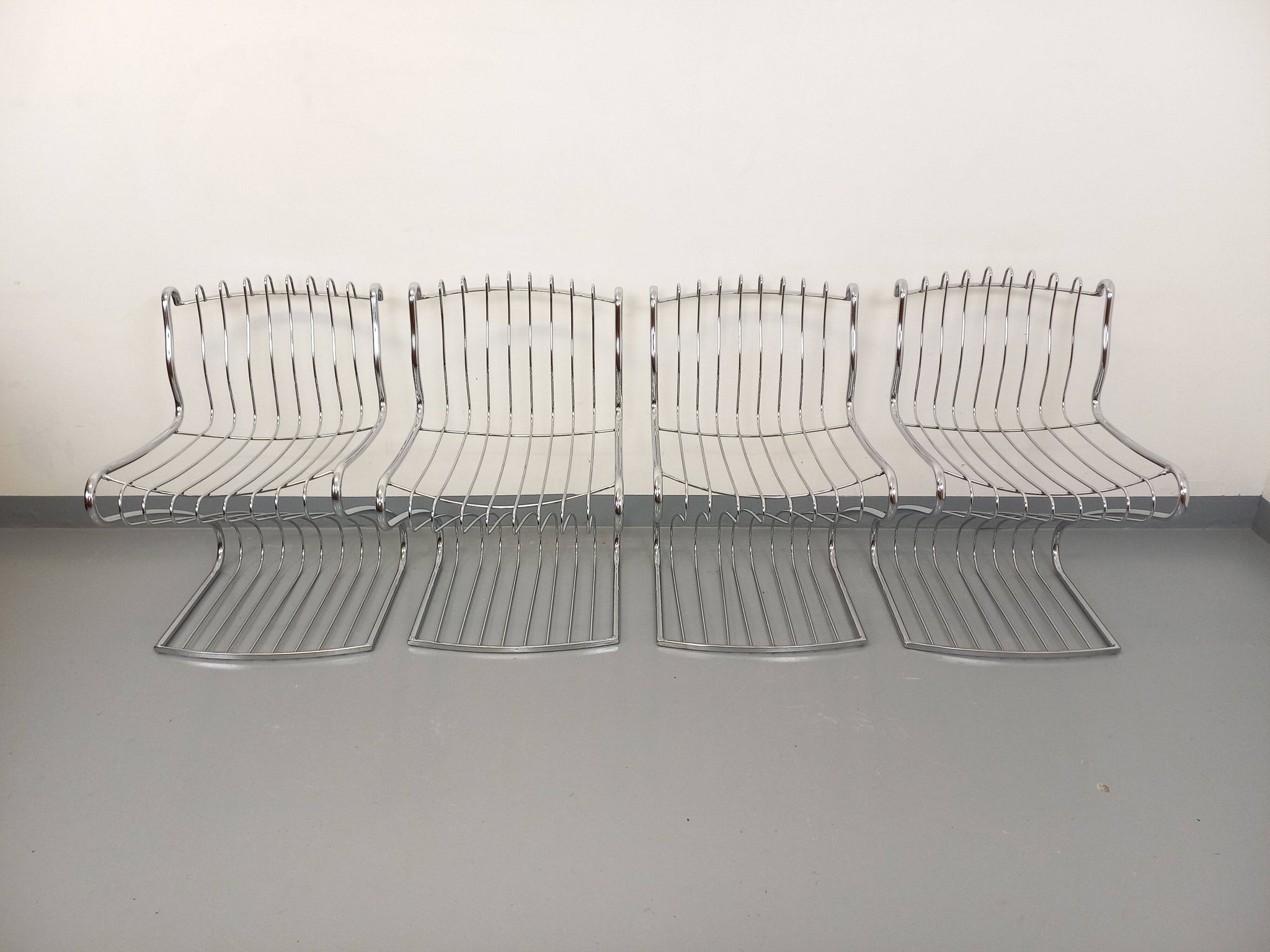 Set of 4 vintage Italian chairs by Gastone Rinaldi in chrome metal.