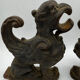 Pair of winged chimera and dragon fire dogs in cast iron