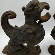 Pair of winged chimera and dragon fire dogs in cast iron