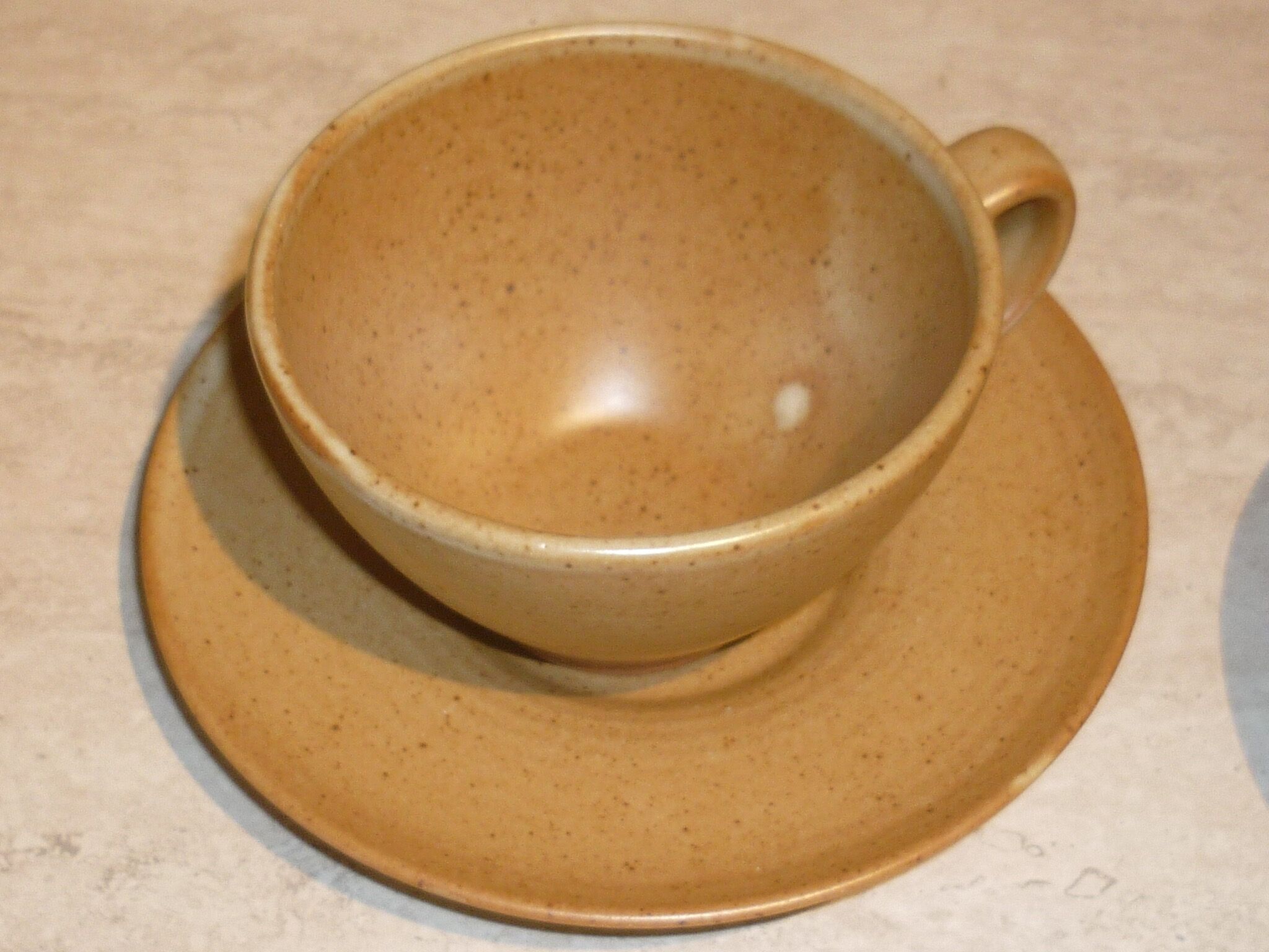 CNP Village stoneware cups and sub-cups