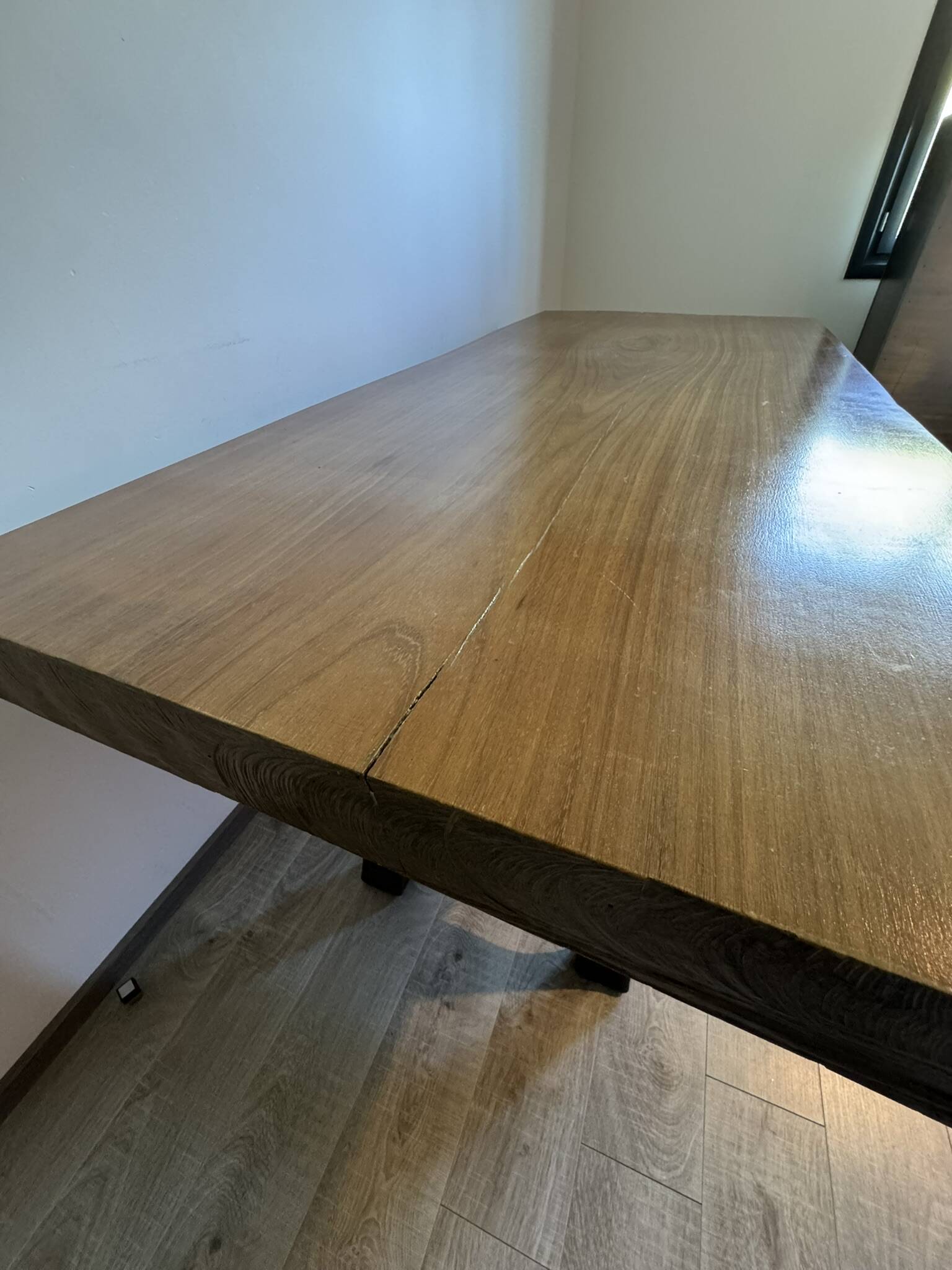 Industrial style table with a mahogany top.