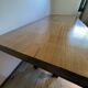 Industrial style table with a mahogany top.