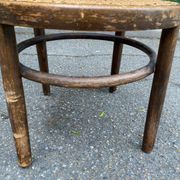 Vintage 19th-century bistro chair made of curved solid wood and caned in the Thonet style.