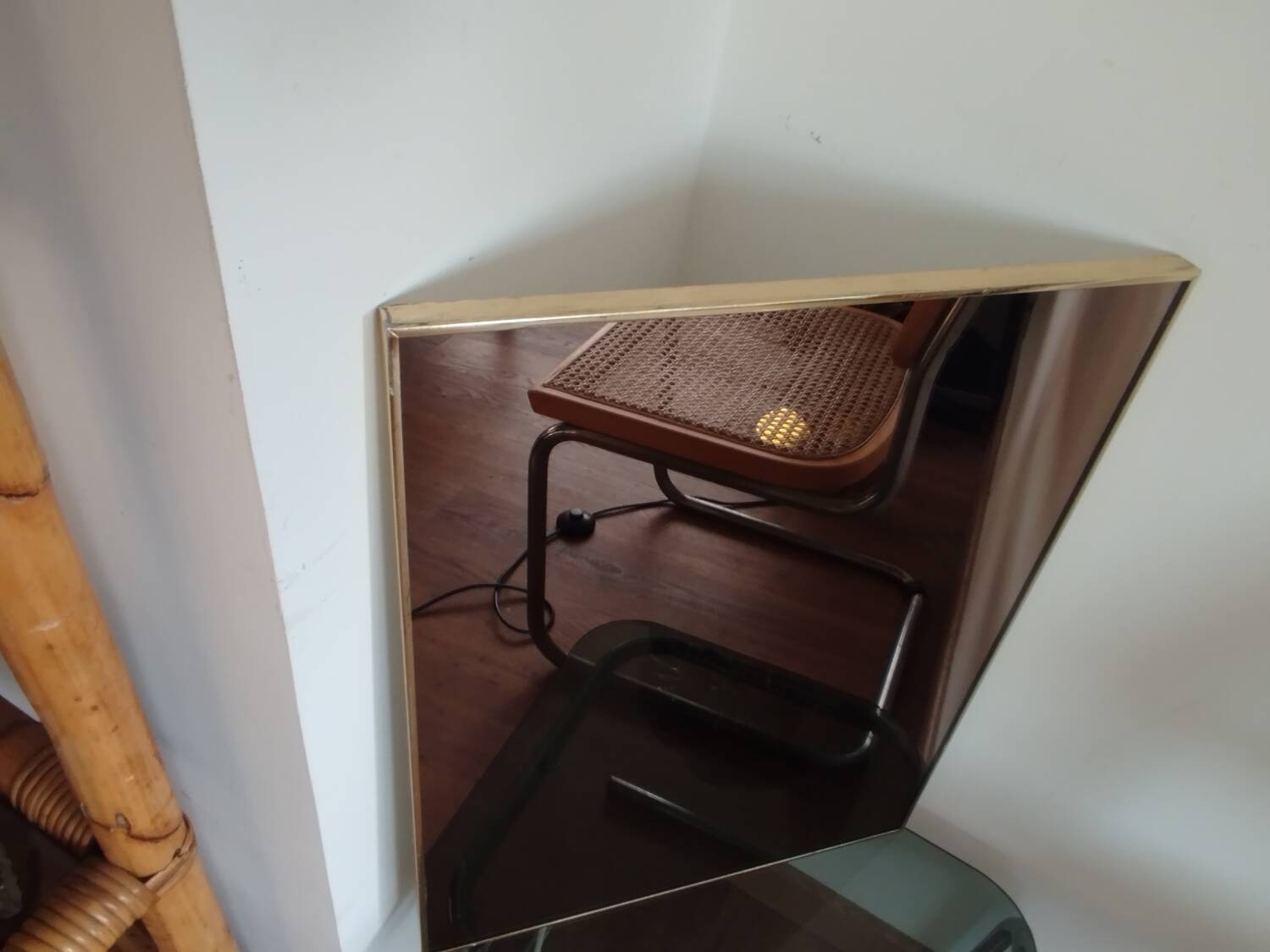 Vintage mirror in gilded brass and smoked glass. circa 1970