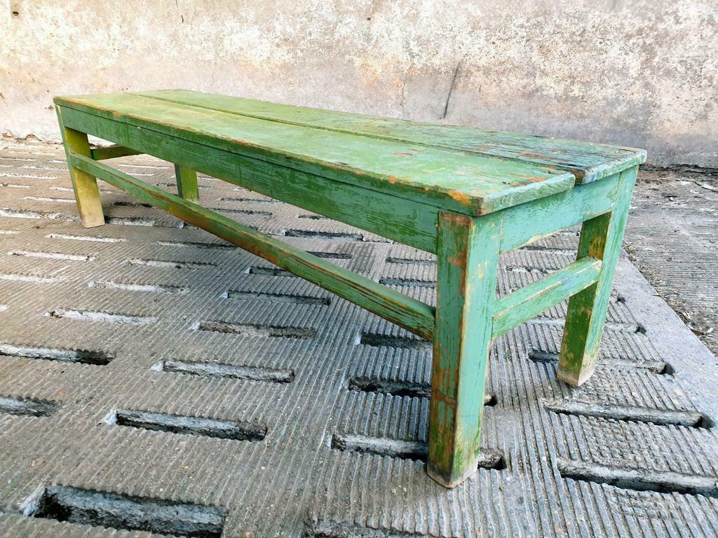 Old wooden bench sidetable green