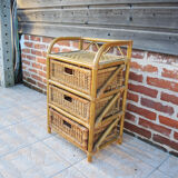 Old chest of drawers with 3 bamboo and wicker drawers.