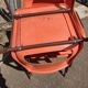 6 orange chairs