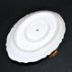 Vintage pouring sauce boat in floral porcelain with gilding.