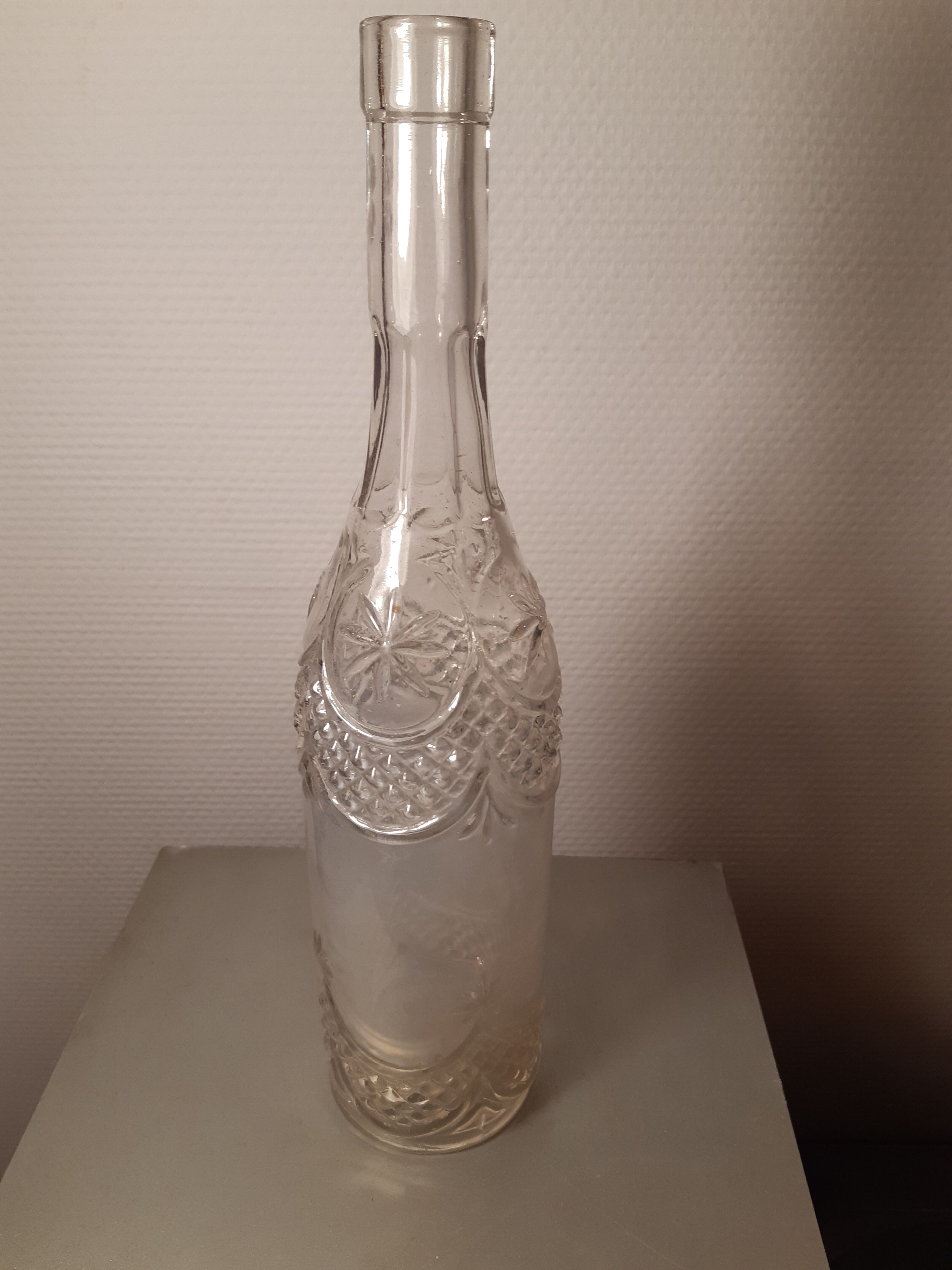 Engraved antique bottle