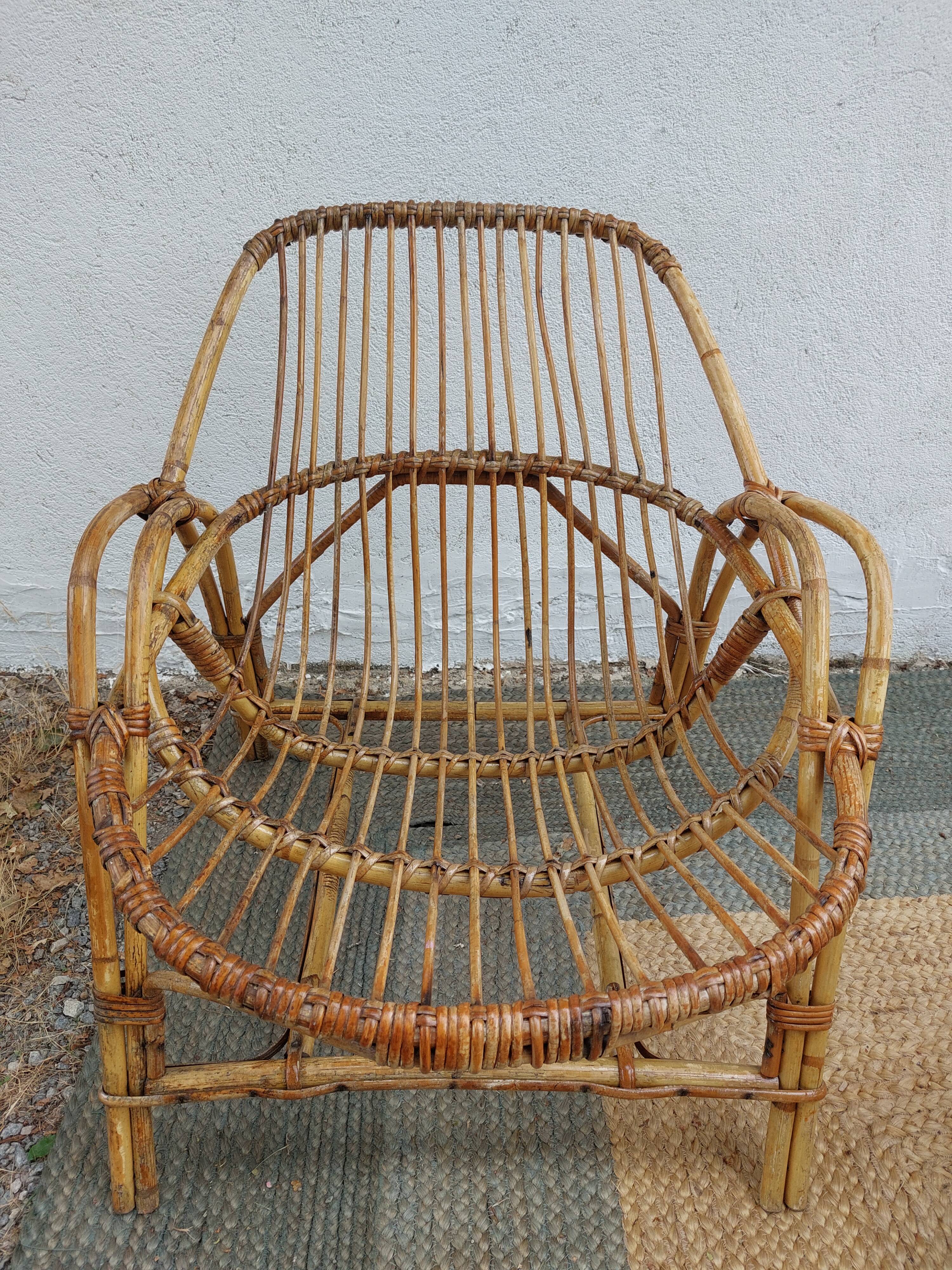 4 armchairs and a coffee table made of rattan and bamboo wood, vintage.
