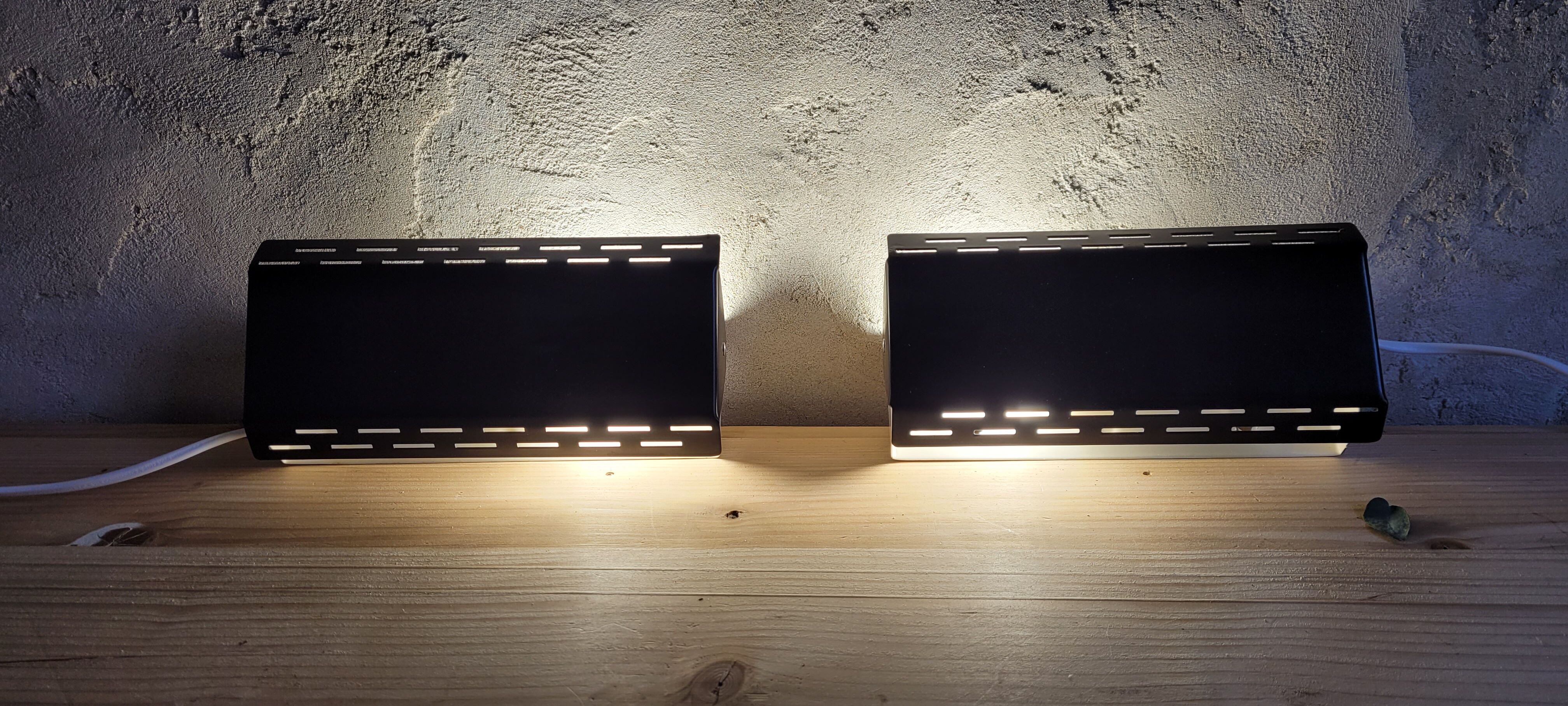 Pair of wall sconces with adjustable shutter