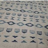 Handmade white and blue rug made of natural wool