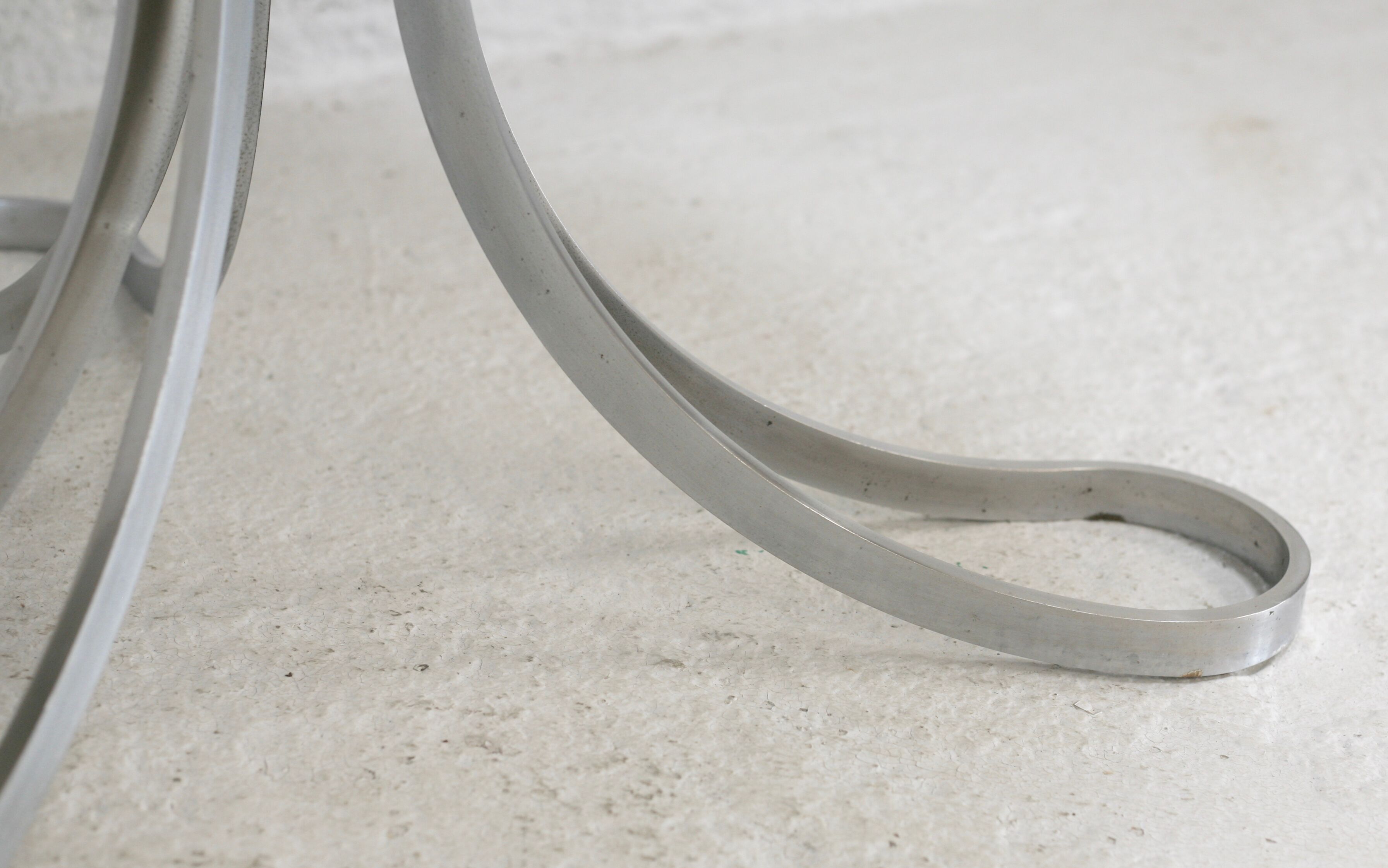 Living room table "Space Age" polished steel, circular slab smoked glass. France, circa 1970.