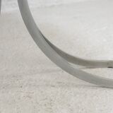 Living room table "Space Age" polished steel, circular slab smoked glass. France, circa 1970.