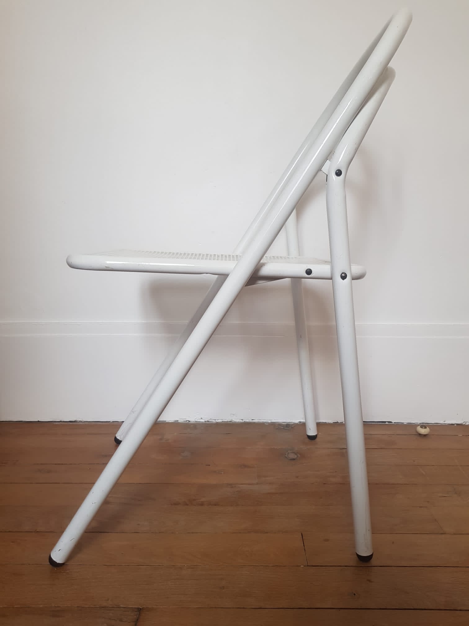 Vintage perforated metal folding chair