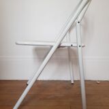 Vintage perforated metal folding chair