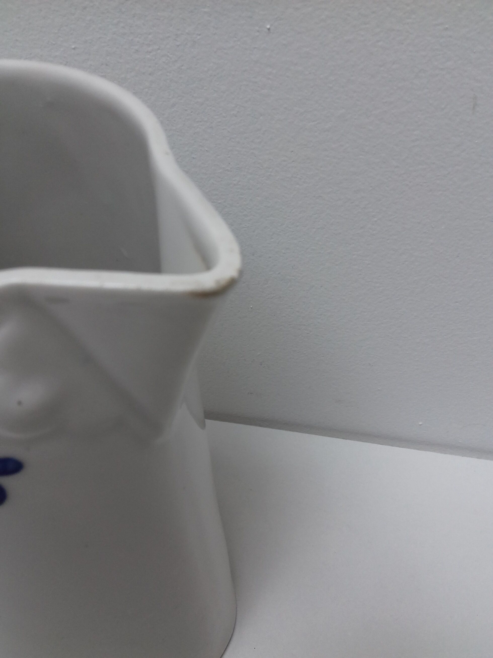 Ancient pitcher ceramic blue flowers