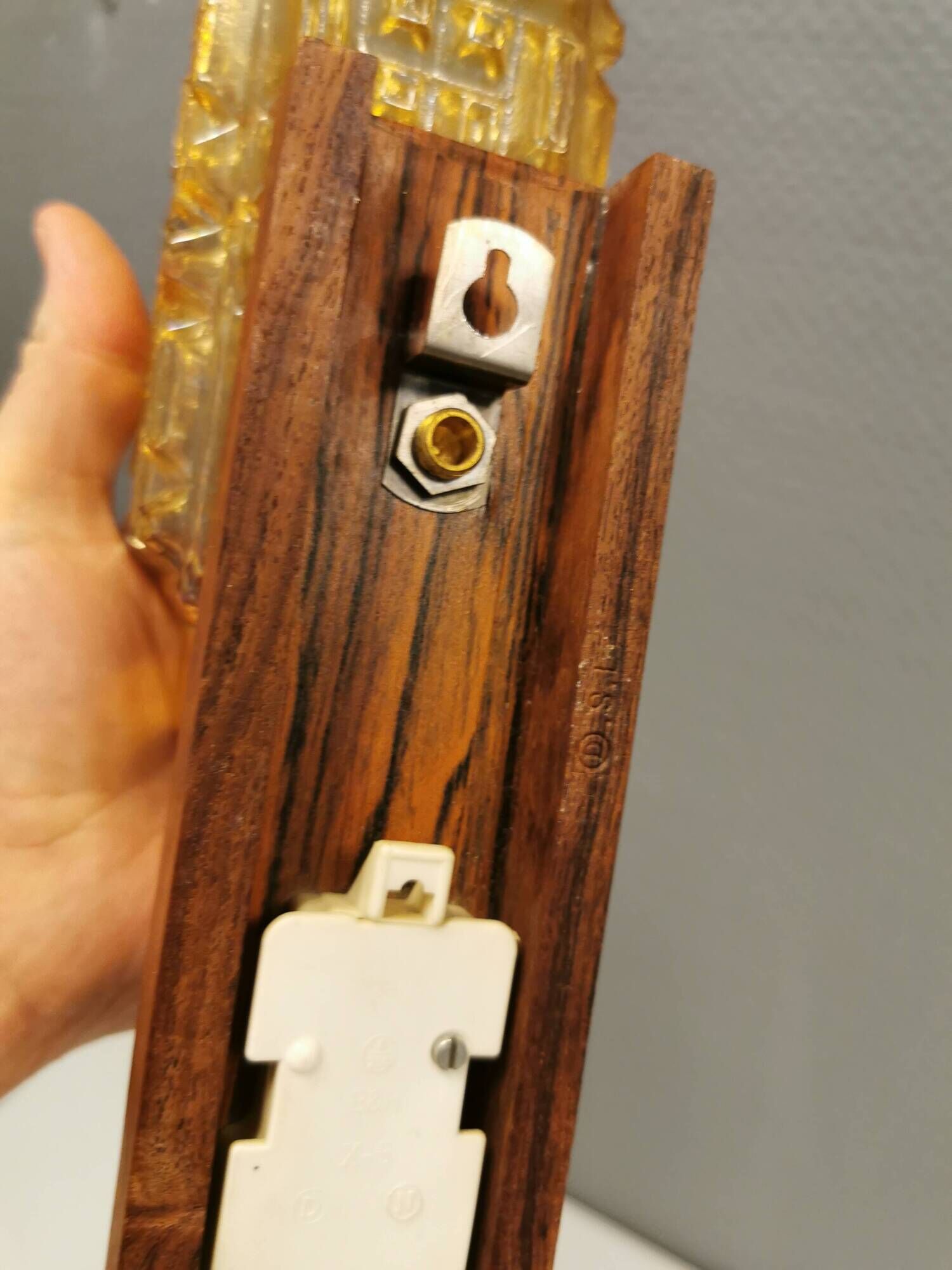 wall lights in rosewood look, with amber coloured glass and brass details.