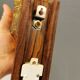 wall lights in rosewood look, with amber coloured glass and brass details.