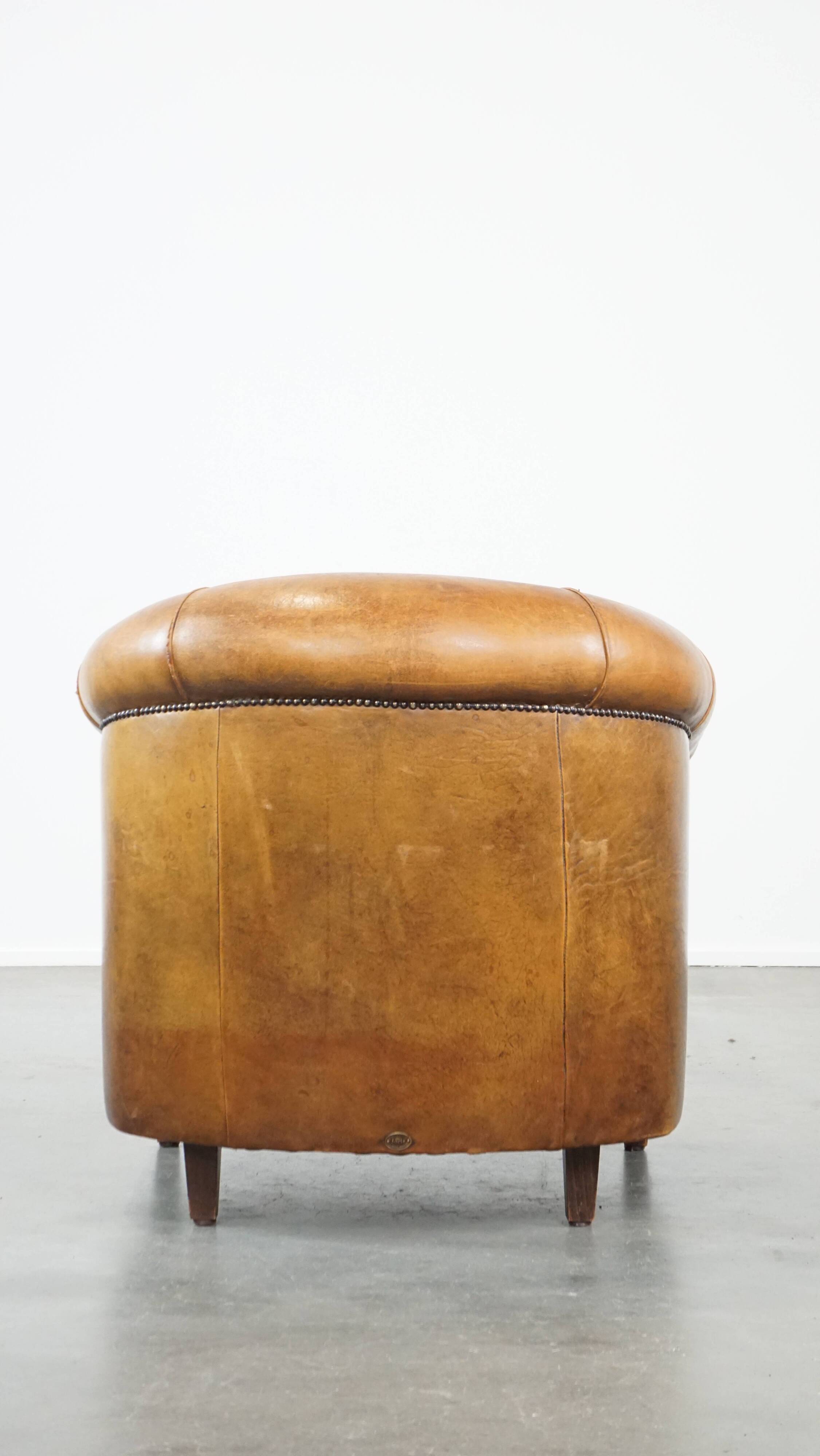 Cognac-colored sheep leather club chair with patina