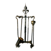 Mid-20th century fireplace accessories in wrought iron with fleur-de-lis.