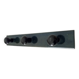 Vintage wall-mounted coat rack in lacquered wood from the 60s