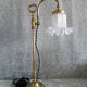 Adjustable brass desk lamp with frosted glass tulip