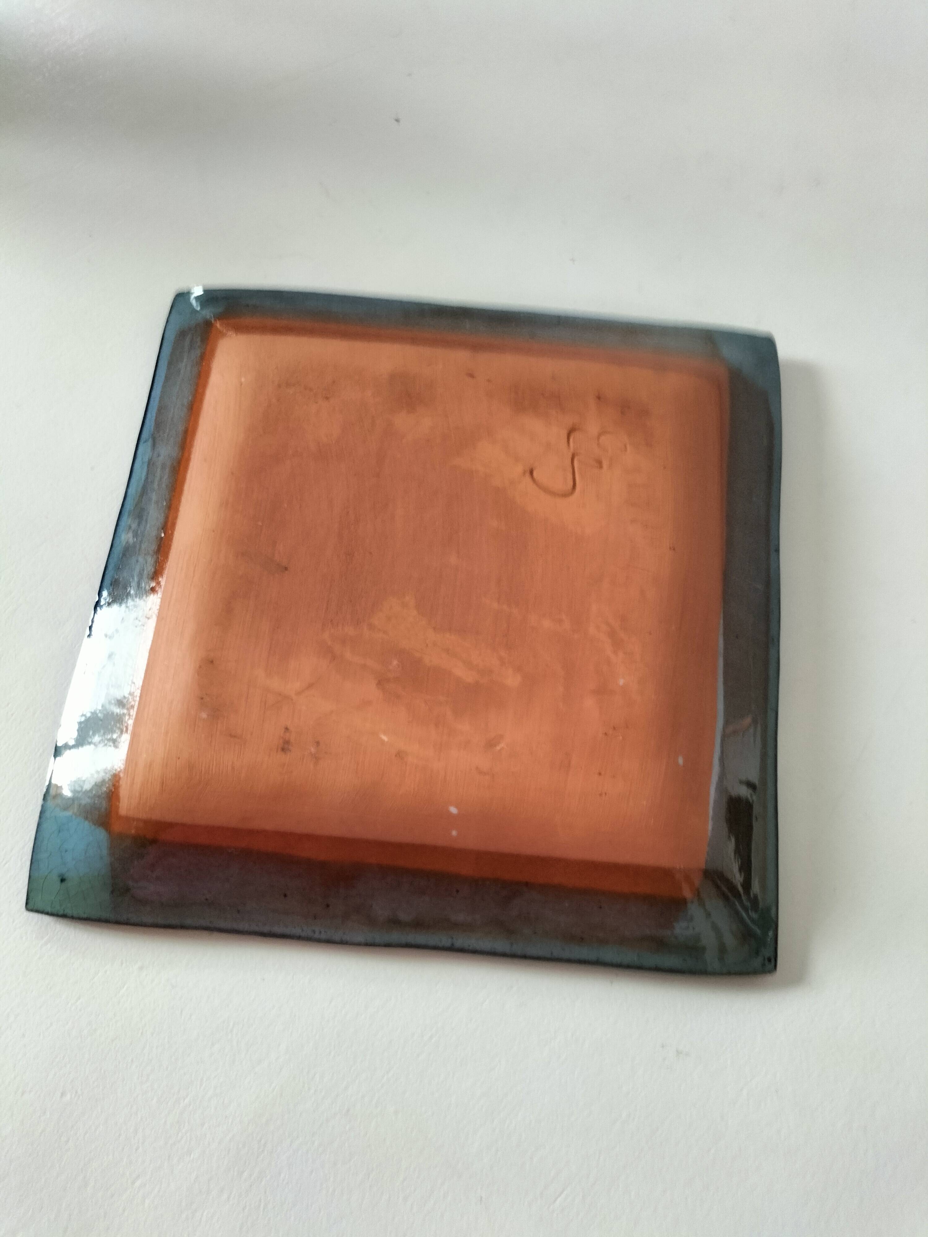 Square turquoise glazed stoneware dish, abstract floral decoration, signed.